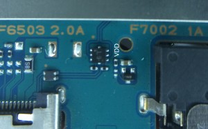 Found on the bottom of the board, near the multi-connector